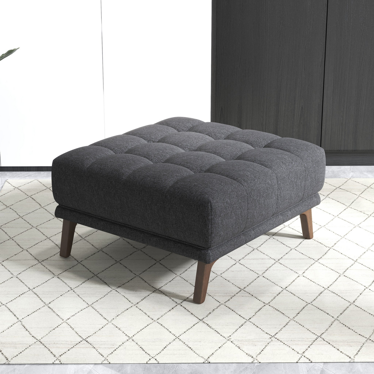 Modern dark gray tufted ottoman on geometric rug, FredCo International furniture