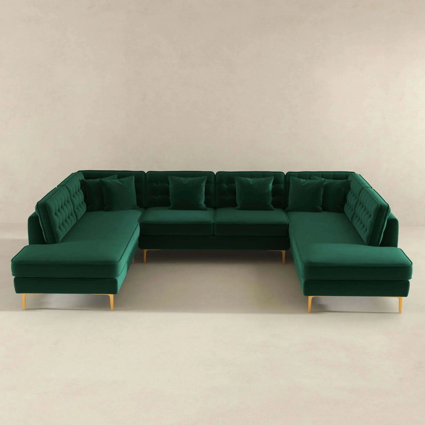 Modern green velvet U-shaped sectional sofa with tufted back and gold legs in minimal room