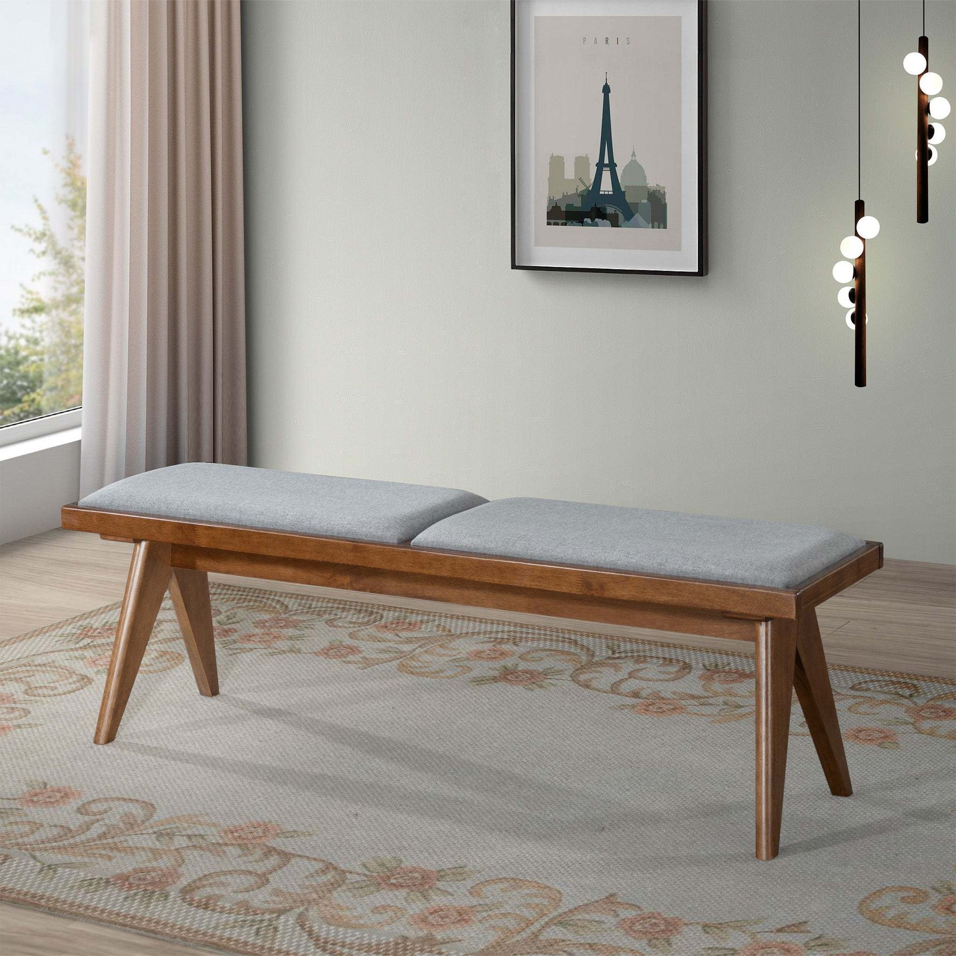 Mid-century modern wood bench with gray cushion in a bright living room, FredCo International furniture
