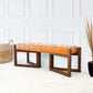 Modern tan leather bench with wooden legs on white rug, home furniture from FredCo International