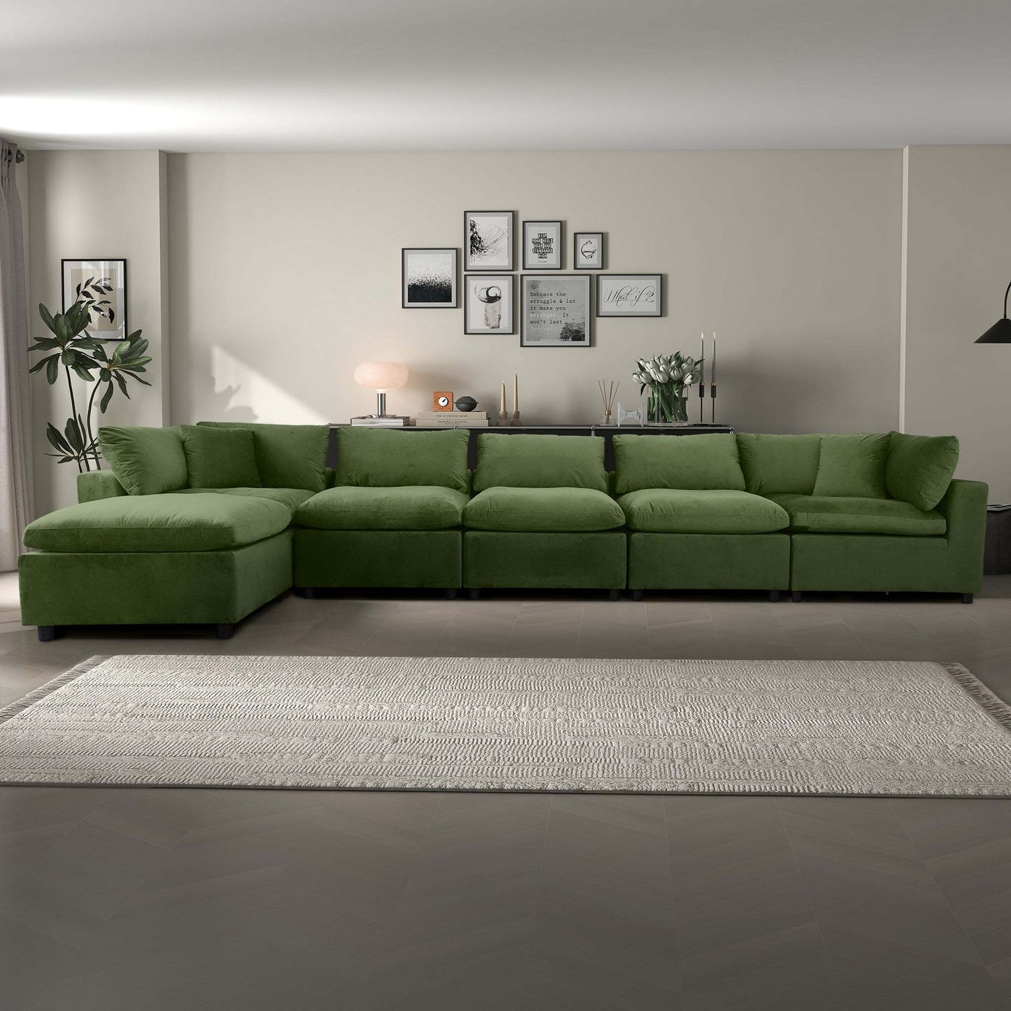 Modern living room with green sectional sofa, framed art, and neutral decor from FredCo International