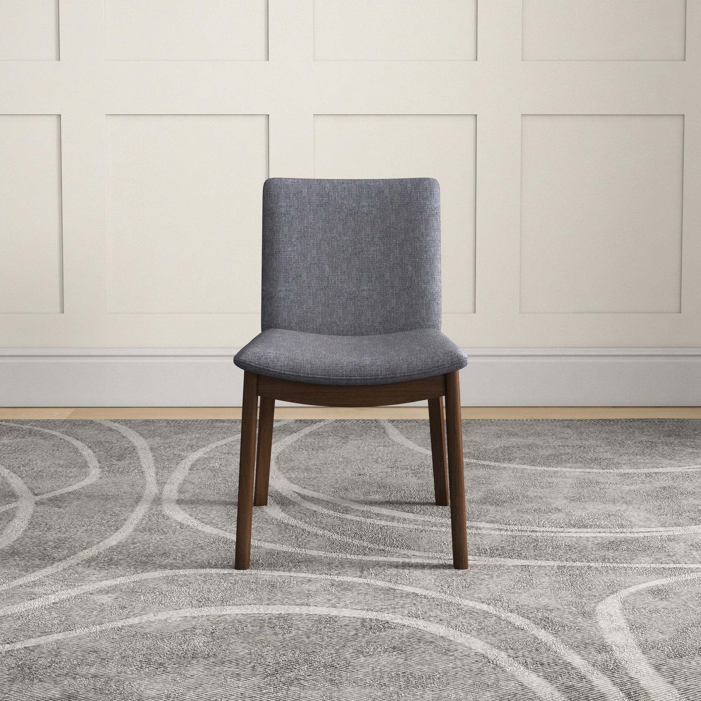 Modern gray upholstered dining chair with wood legs on patterned rug, FredCo International furniture