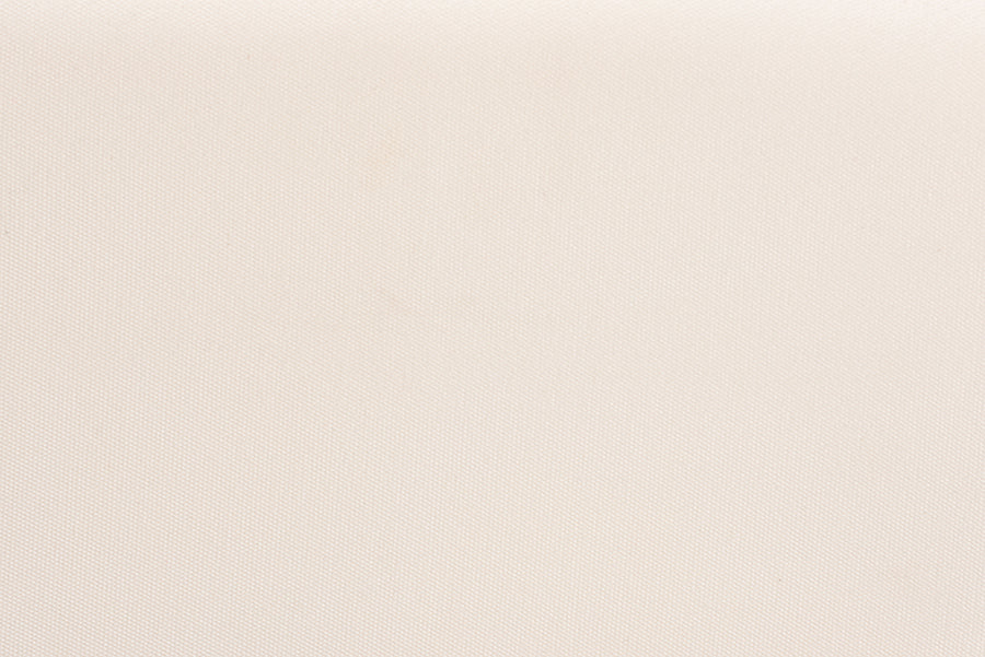 Close-up of plain beige fabric texture, ideal for home furniture upholstery.