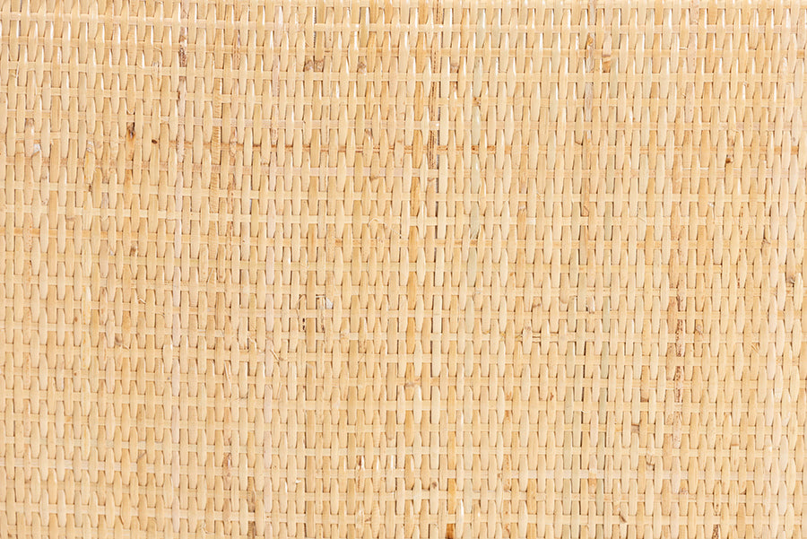 Close-up of natural woven cane furniture texture, ideal for home decor accents