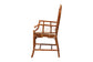 Side view of a wooden armchair with lattice design and white cushion, FredCo International furniture