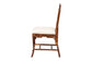 Side view of rattan dining chair with cushioned white seat from FredCo International
