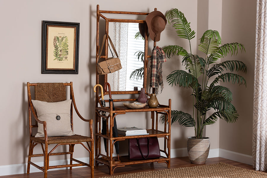 Entryway with bamboo hall tree, woven chair, potted plant, and framed botanical art