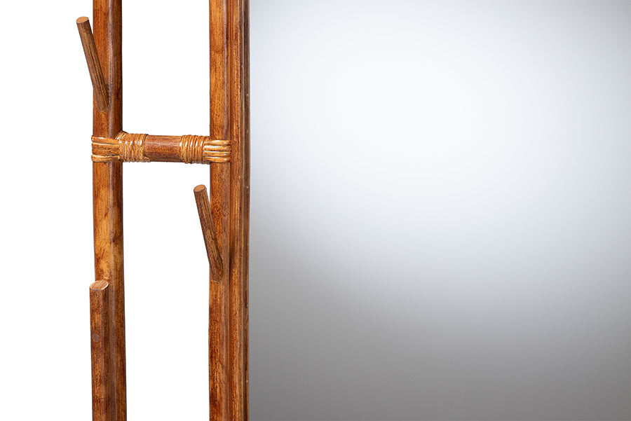 Close-up of rustic wood framed mirror with natural branch details, FredCo International furniture