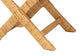 Close-up of woven rattan furniture legs, natural finish, home décor detail