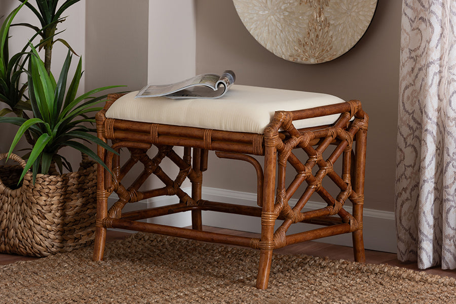 Rattan accent bench with cushioned seat in a cozy home setting, near a plant and woven basket