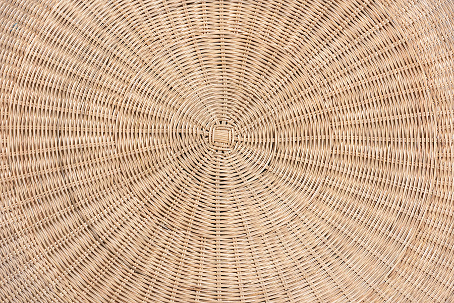 Close-up of woven rattan texture, circular pattern, furniture detail from FredCo International
