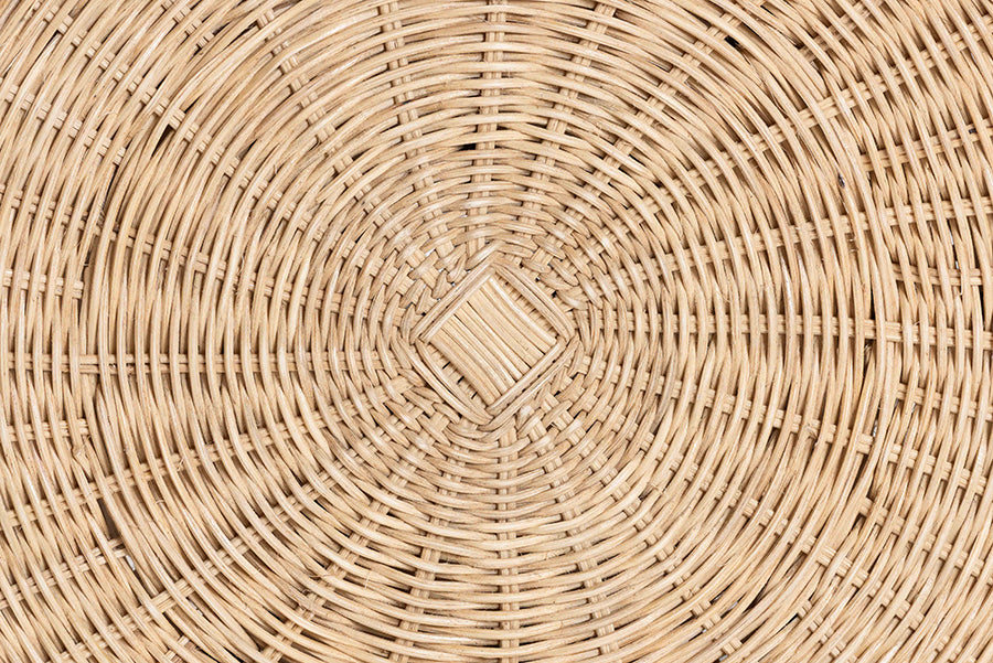 Close-up of round woven rattan furniture detail, natural wicker texture pattern