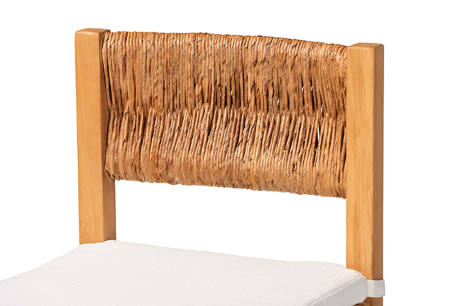 Natural wood dining chair with woven rattan backrest and white cushion from FredCo International