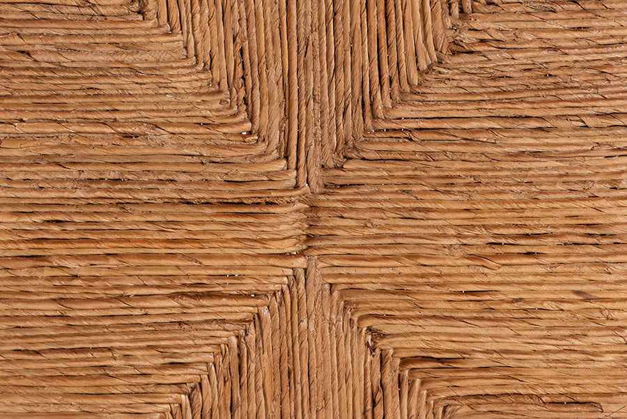 Close-up of woven rattan furniture detail, natural texture from FredCo International