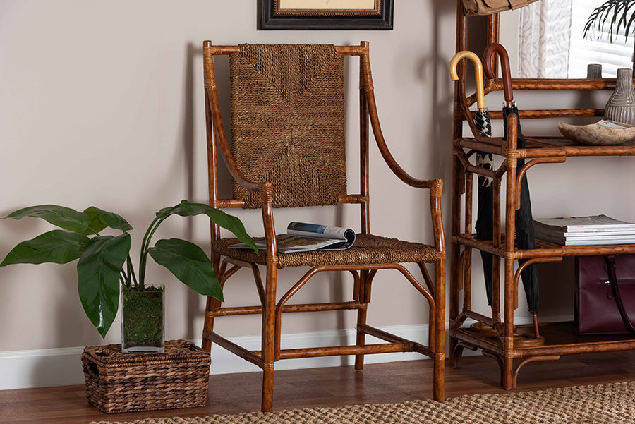 Rattan accent chair with woven seat in a cozy entryway, next to a green plant and umbrella stand.