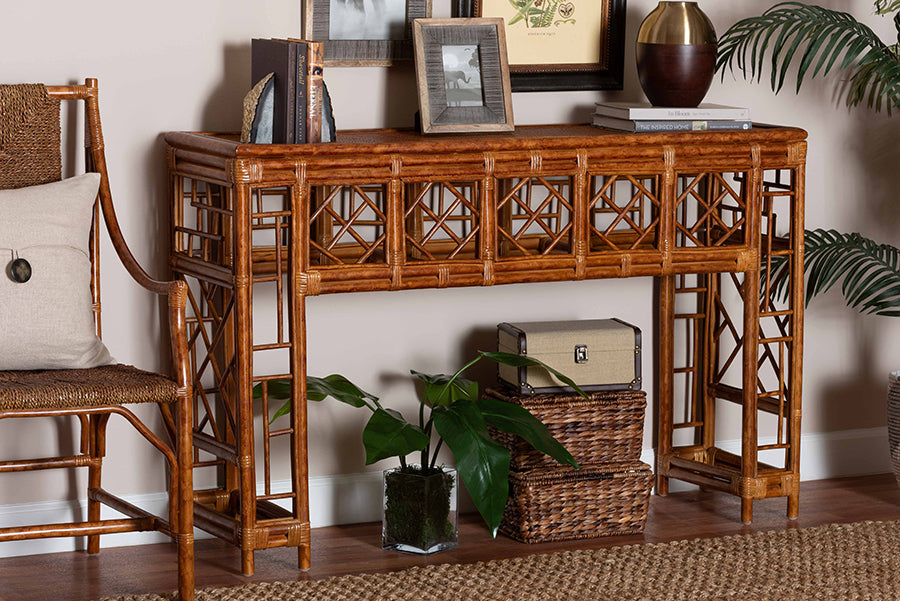 Natural rattan console table with decorative lattice design, styled with books and home decor