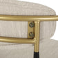 Close-up of beige upholstered chair with gold metal frame, FredCo International furniture