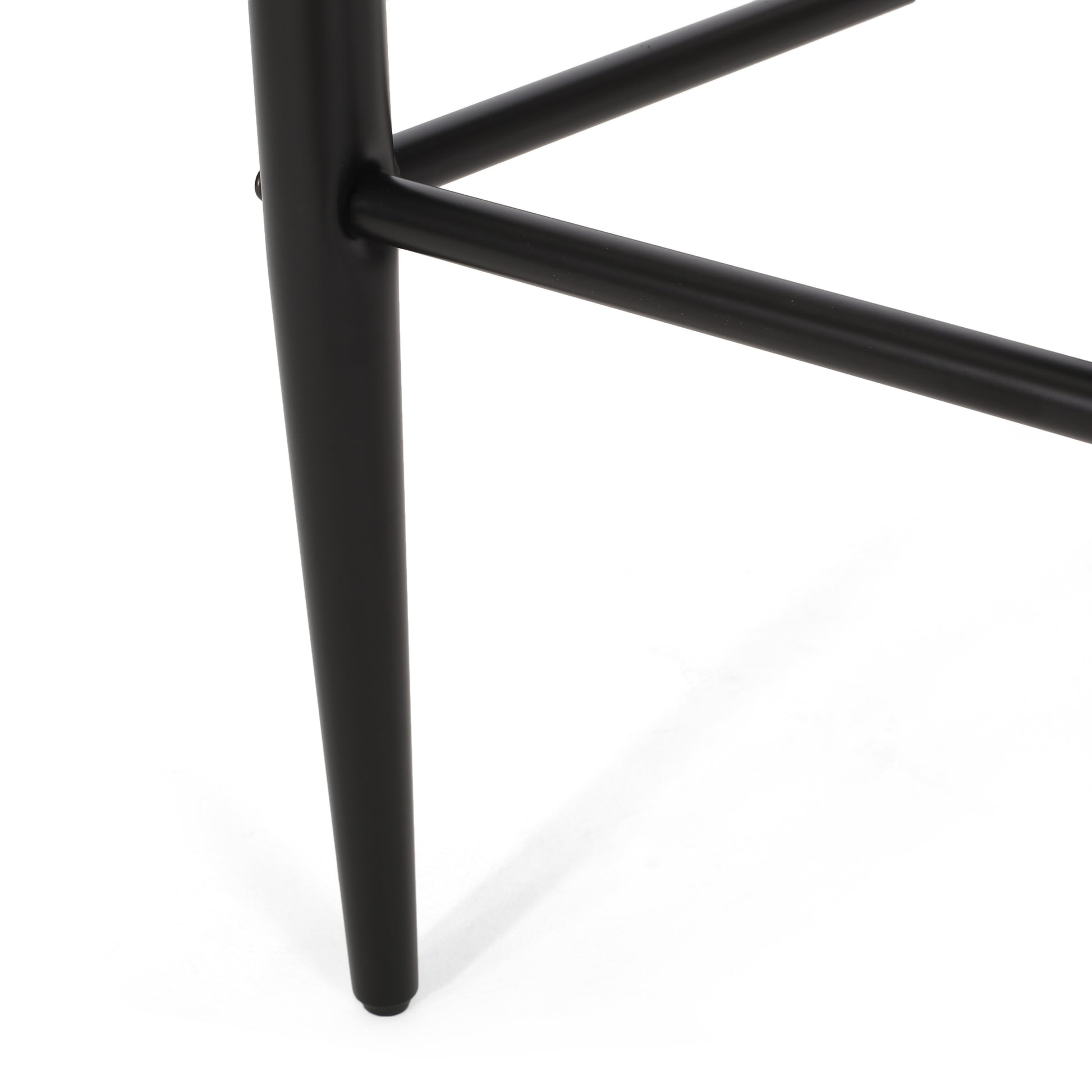 Black metal chair leg with horizontal support bar on white background, modern furniture