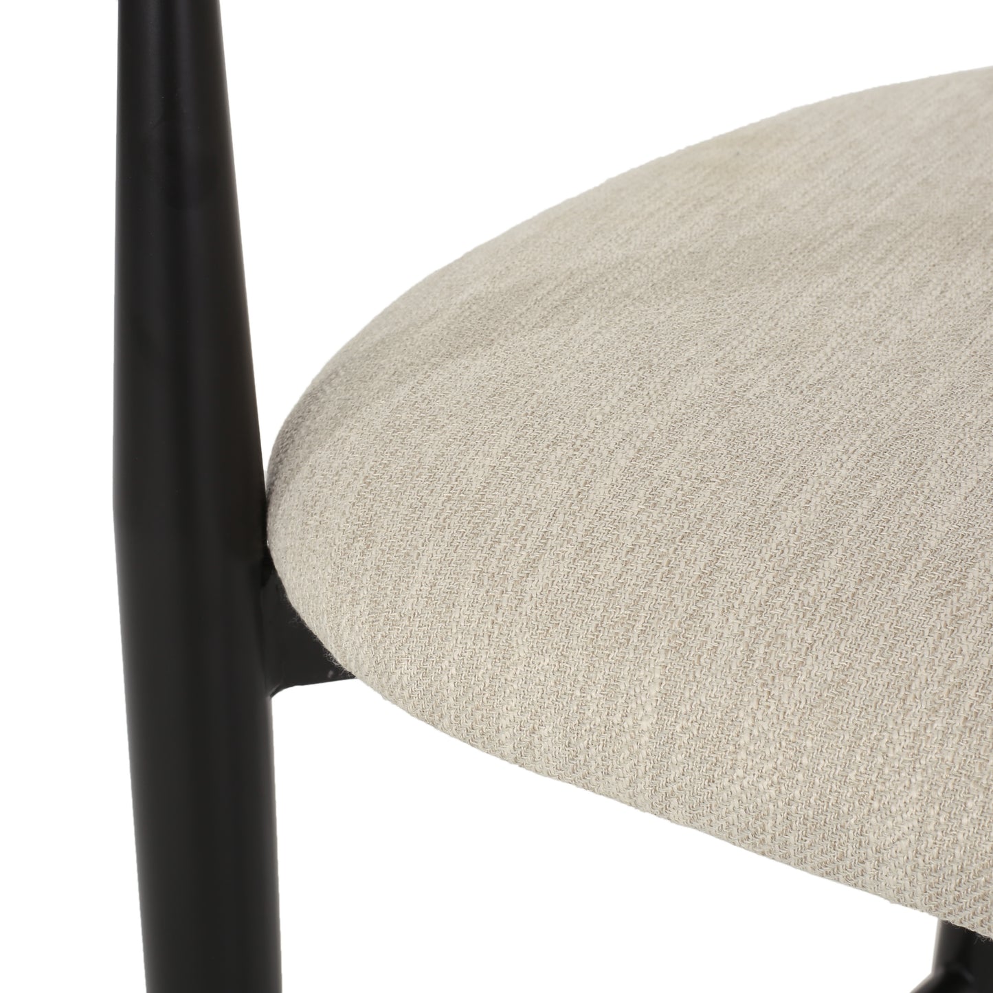 Close-up of beige upholstered dining chair seat with black wood frame