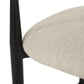 Close-up of beige upholstered dining chair seat with black wood frame