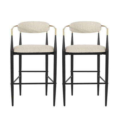 Pair of modern beige upholstered bar stools with black metal frames and gold accents