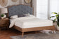 Modern bedroom with upholstered bed, wood frame, and nightstand from FredCo International