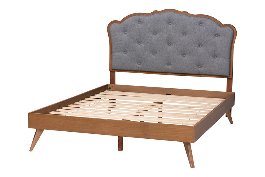 Mid-century modern wood bed frame with tufted gray upholstered headboard, no mattress