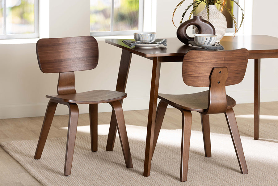 Mid-century modern wood dining chairs and table set in bright room, FredCo International furniture