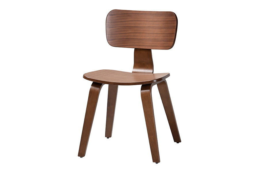 Modern wooden dining chair with curved backrest and seat, FredCo International furniture.
