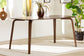 Modern wood dining table in bright living room, FredCo International furniture