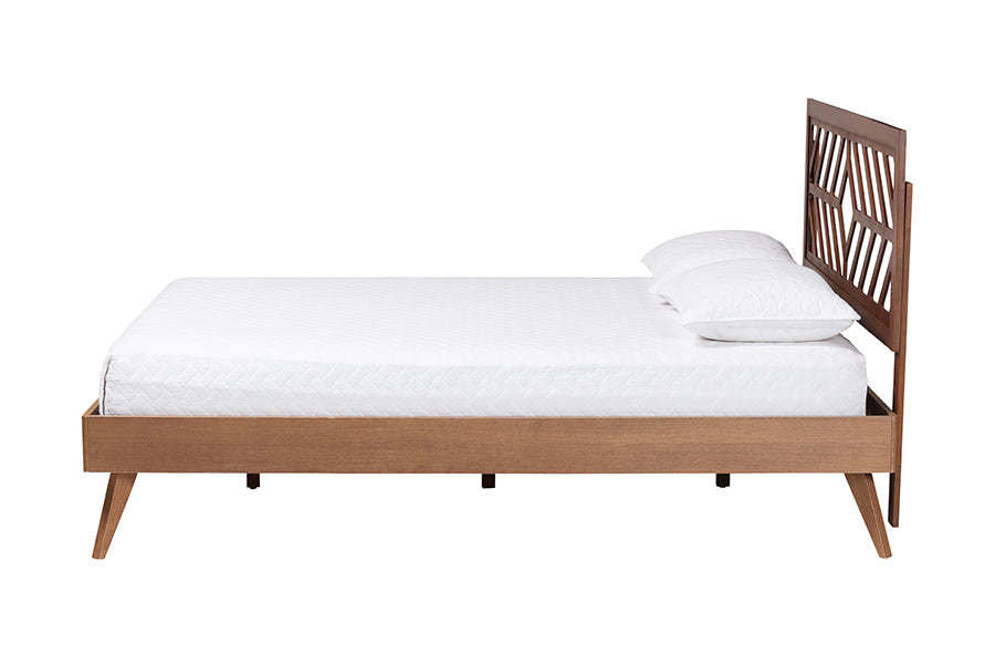 Mid-century modern wooden bed frame with geometric headboard and white bedding