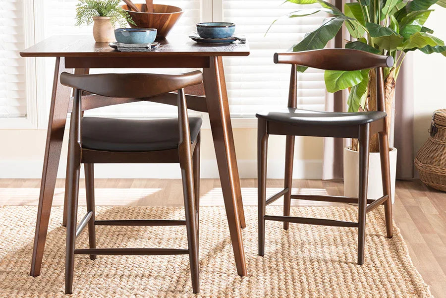 Baxton Studio Eira Counter Stool Set of 2- Walnut Wood Frame Counter-height Chair with Curved Backrest and Black Faux Leather Seat, Mid-Century Modern Kitchen Island Seating FredCo