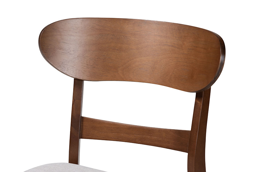Modern wooden dining chair with curved backrest and light fabric seat from FredCo International