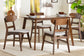 Mid-century modern wood dining set with four chairs in a bright dining room, sold by FredCo International.