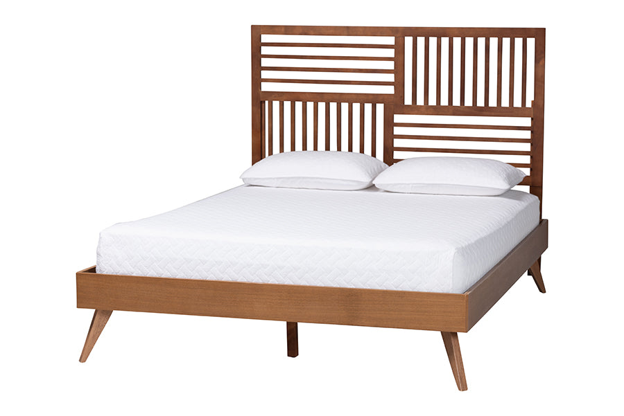 Modern wooden bed frame with geometric headboard and white bedding from FredCo International