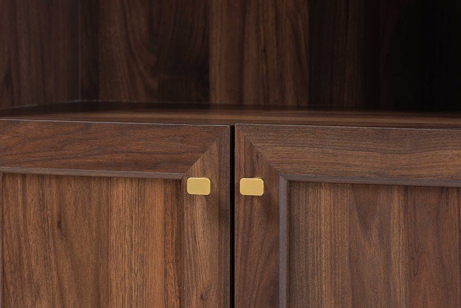 Close-up of modern wood cabinet with gold hardware by FredCo International furniture