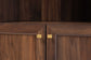 Close-up of modern wood cabinet with gold hardware by FredCo International furniture