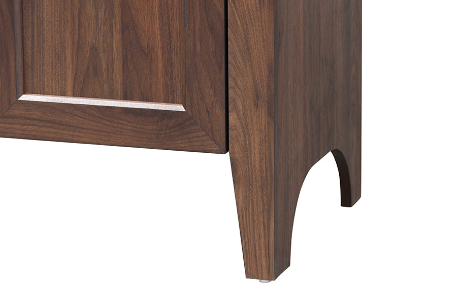 Close-up of modern wood furniture leg with rich brown finish, FredCo International