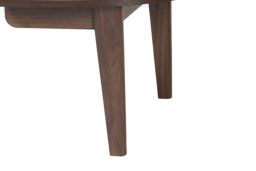 Close-up of mid-century modern wooden table legs, furniture detail from FredCo International.