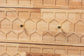 Baxton Studio Hosea Japandi Carved Honeycomb Natural 6-Drawer Dresser FredCo