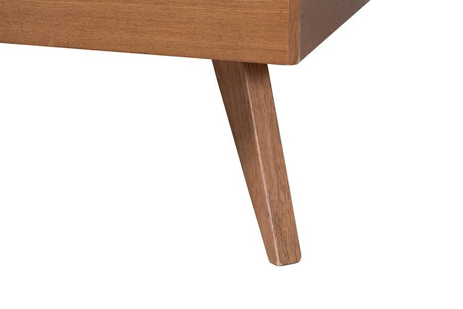 Close-up of modern wooden furniture leg with natural finish, FredCo International
