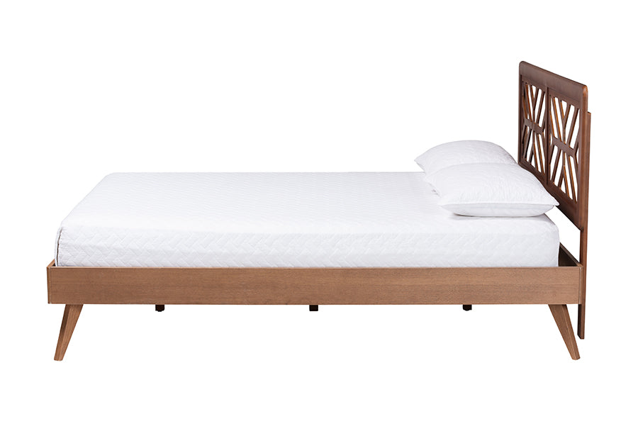 Mid-century modern wooden bed frame with geometric headboard, white mattress and pillows