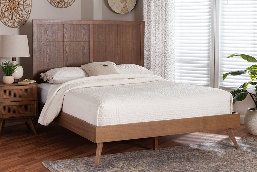 Mid-century modern wooden bed with white bedding in a bright, stylish bedroom