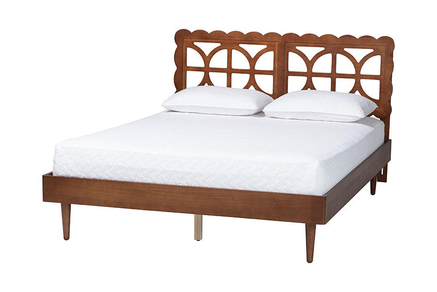Mid-century modern wooden bed frame with geometric headboard and white bedding at FredCo International