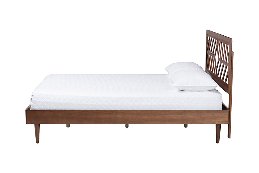 Modern wooden bed frame with geometric headboard and white bedding from FredCo International