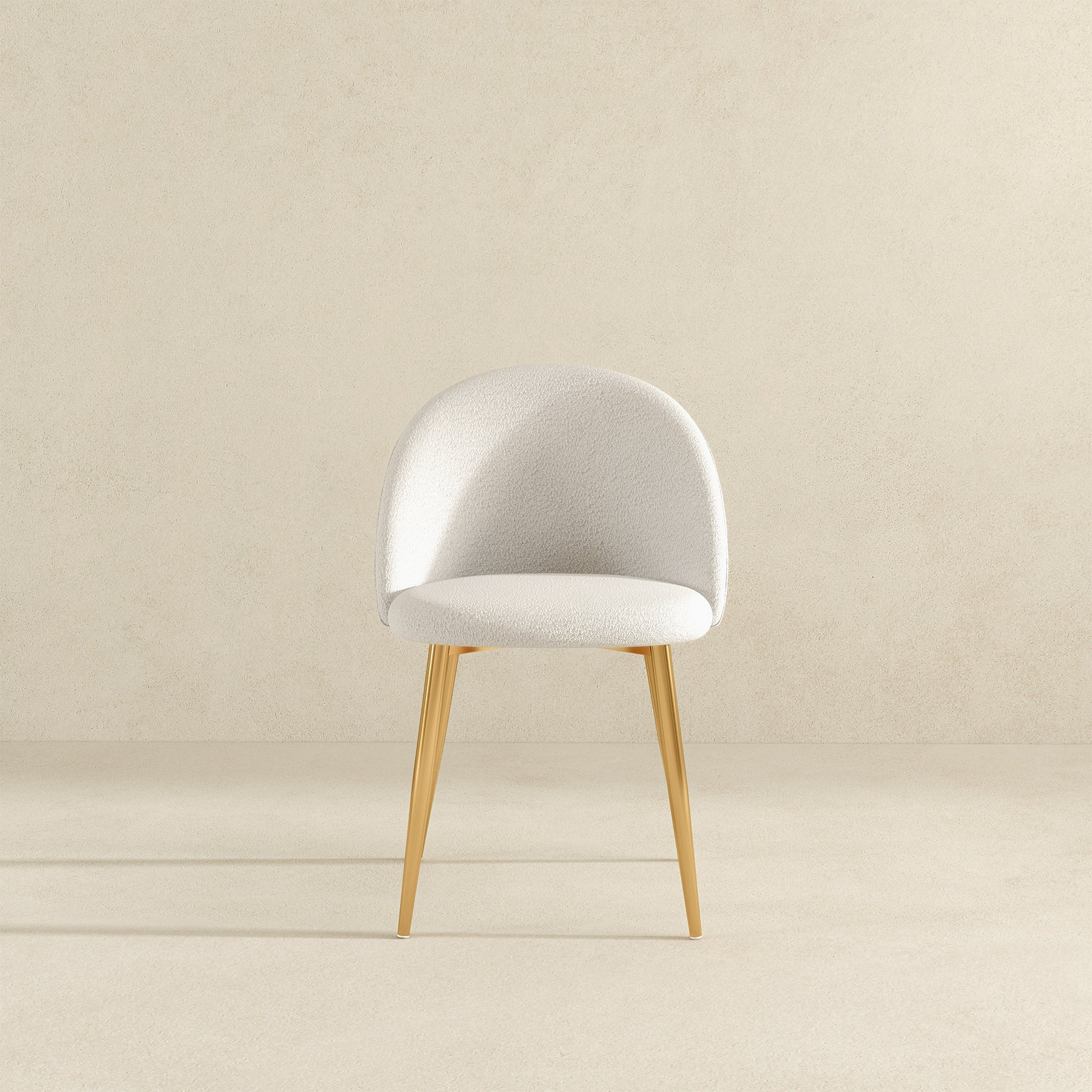 Modern white accent chair with gold legs, minimalist design, FredCo International furniture
