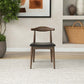 Modern wooden dining chair with black seat in a stylish home interior, FredCo furniture