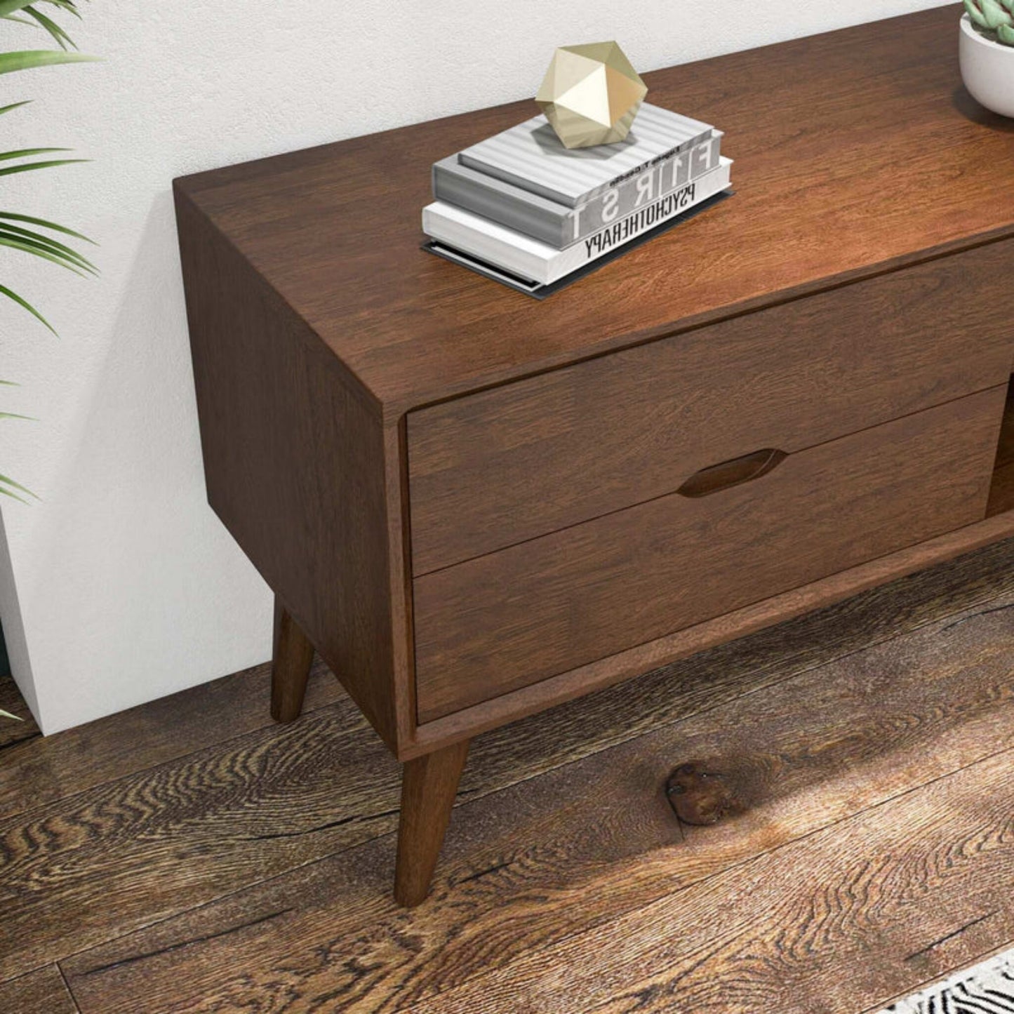 Mid-century modern wood console table with books and decor, FredCo International furniture