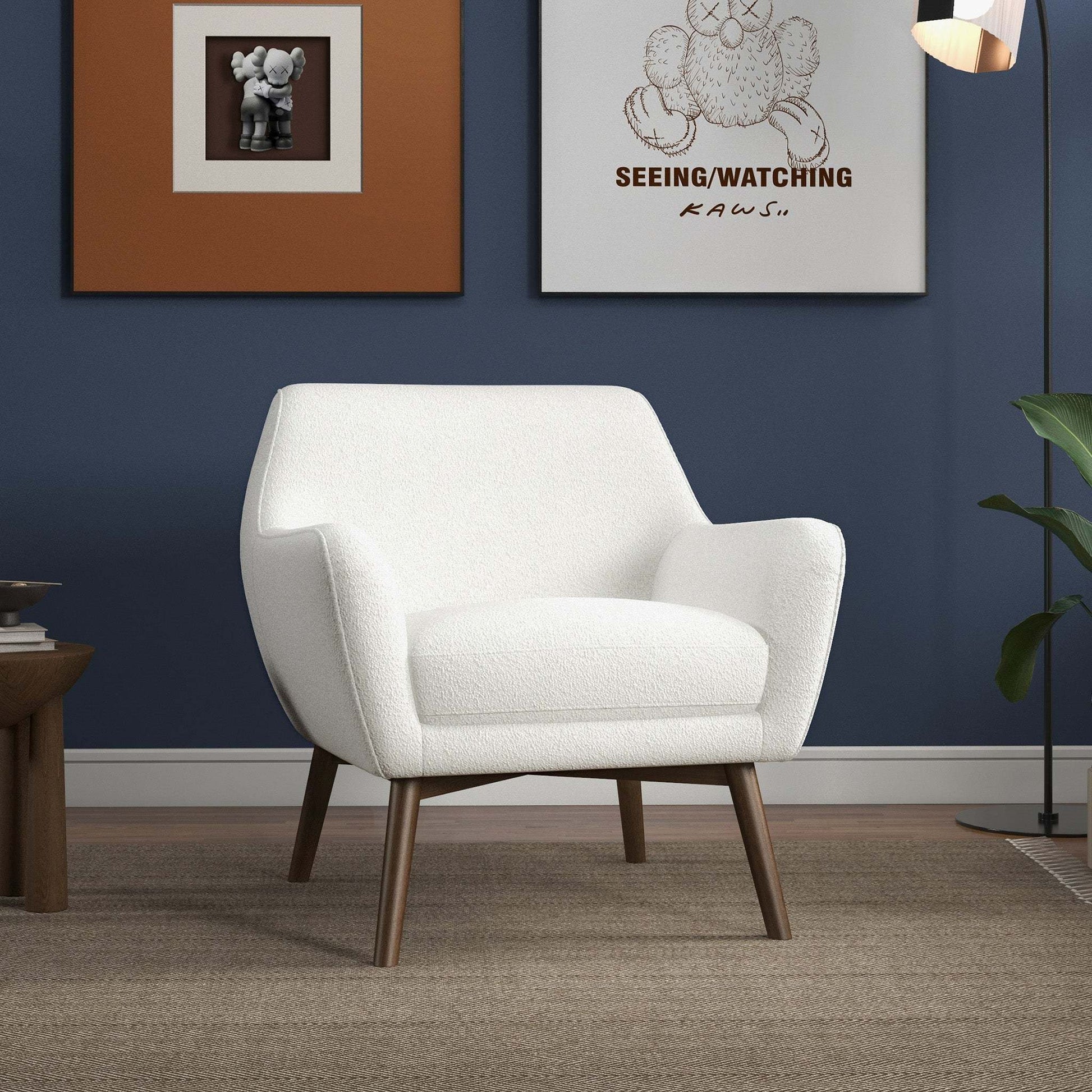 Mid-century modern white armchair with wooden legs in stylish living room, FredCo International furniture