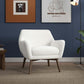 Mid-century modern white armchair with wooden legs in stylish living room, FredCo International furniture